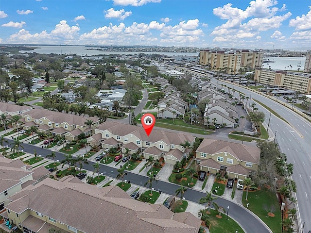 birds eye view of property featuring a residential view and a water view