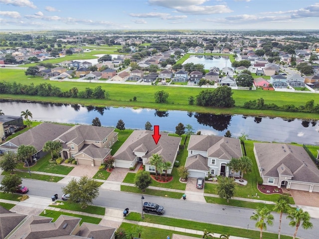 bird's eye view with a water view and a residential view