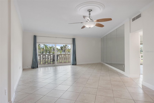 1200 N Shore Dr NE Unit 102, Saint Petersburg, FL 33701 - empty room with crown molding, visible vents, light tile patterned flooring, ceiling fan, and baseboards