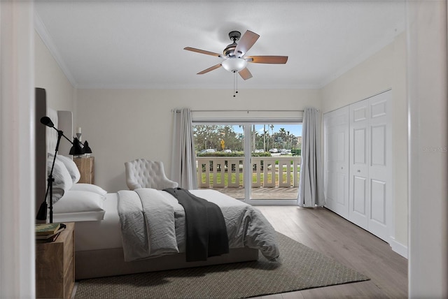 1200 N Shore Dr NE Unit 102, Saint Petersburg, FL 33701 - bedroom with access to exterior, crown molding, ceiling fan, and wood finished floors