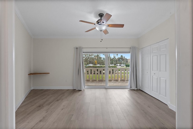 1200 N Shore Dr NE Unit 102, Saint Petersburg, FL 33701 - empty room with baseboards, wood finished floors, a ceiling fan, and crown molding