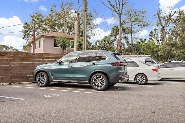1200 N Shore Dr NE Unit 102, Saint Petersburg, FL 33701 - uncovered parking lot featuring fence