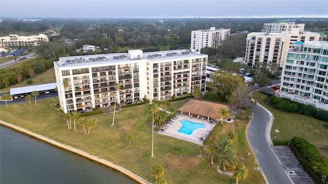 drone / aerial view featuring a water view and a city view