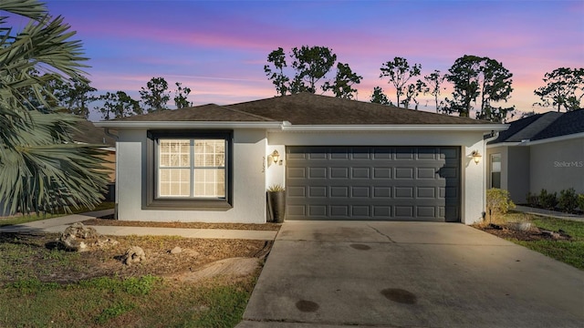 single story home featuring a garage