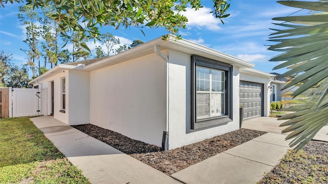 view of side of home with a garage