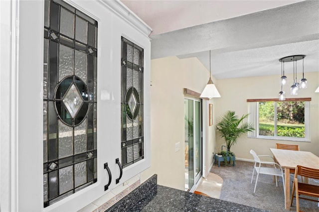 interior space featuring baseboards and a textured ceiling