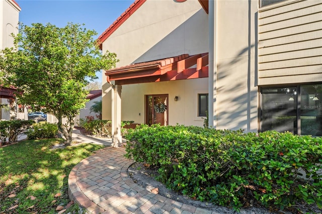 doorway to property with stucco siding