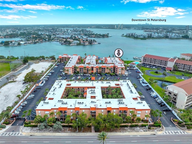 birds eye view of property with a water view