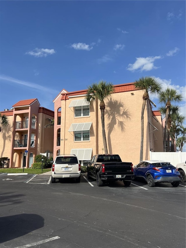 8901 Blind Pass Rd Unit 224, St Pete Beach, FL 33706 - view of building exterior featuring uncovered parking