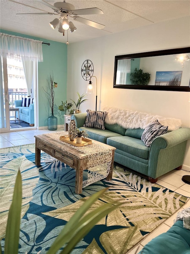 8901 Blind Pass Rd Unit 224, St Pete Beach, FL 33706 - living room featuring tile patterned flooring, a ceiling fan, and baseboards