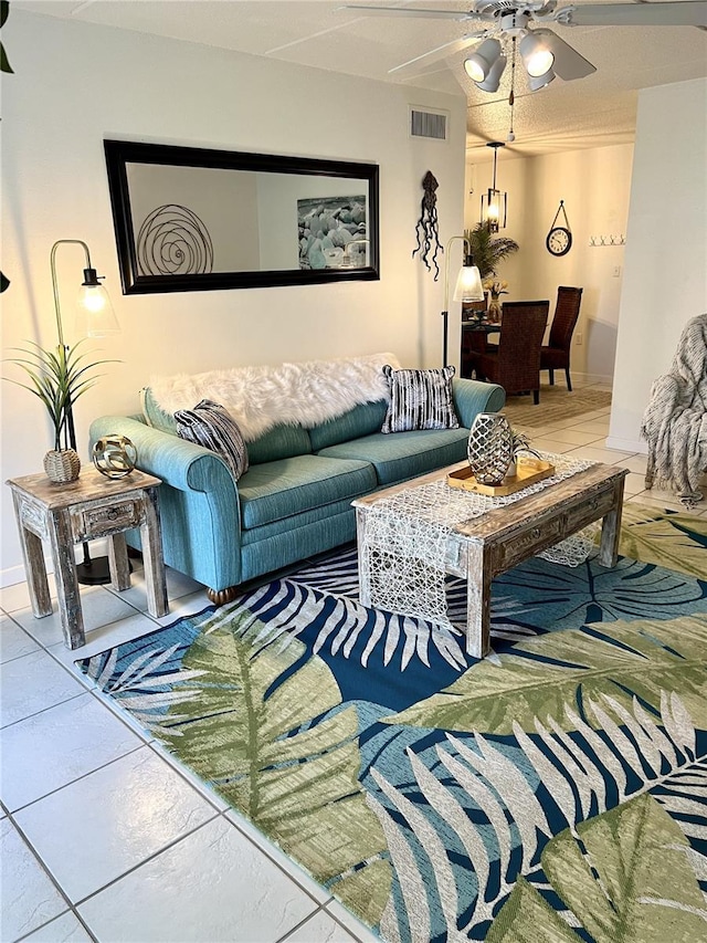8901 Blind Pass Rd Unit 224, St Pete Beach, FL 33706 - living room featuring ceiling fan and tile patterned floors
