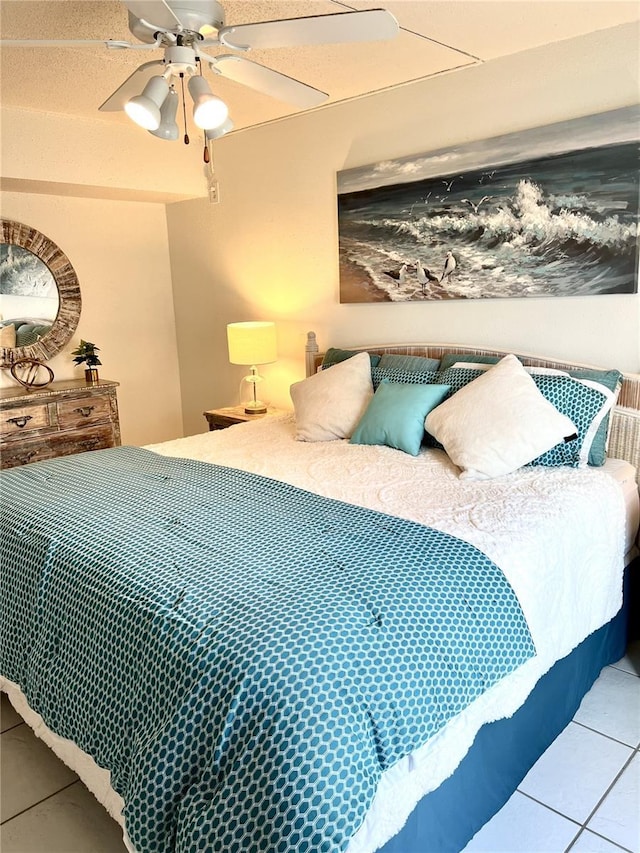 8901 Blind Pass Rd Unit 224, St Pete Beach, FL 33706 - bedroom with tile patterned floors and ceiling fan