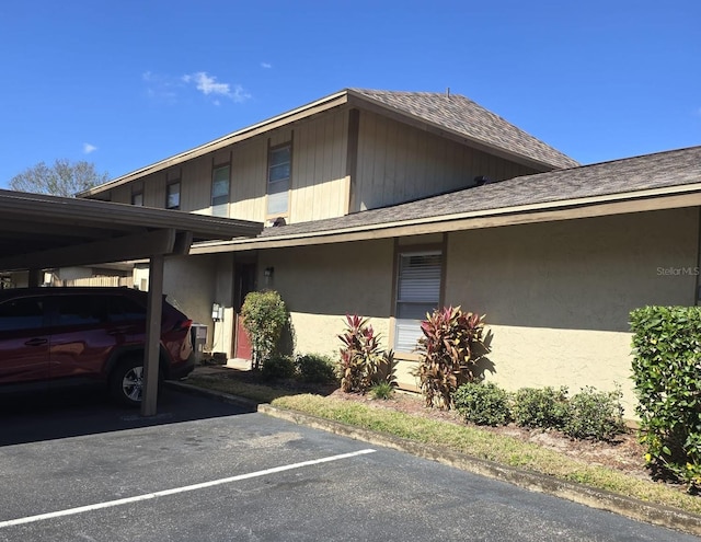 exterior space with a carport