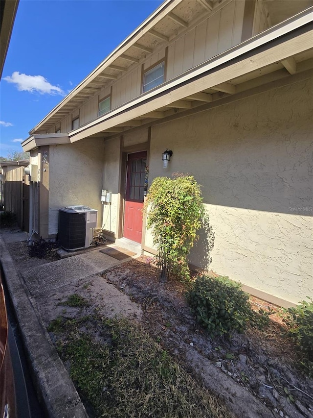 entrance to property featuring central AC unit