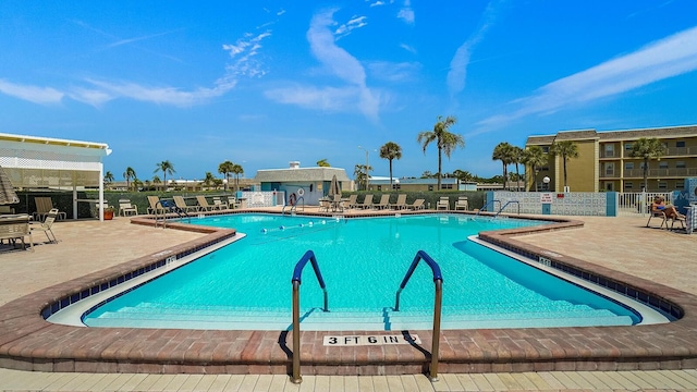 view of swimming pool featuring a patio area