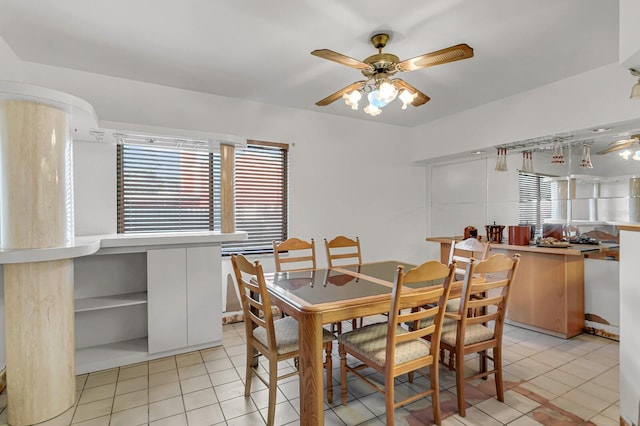 dining area featuring a ceiling fan and light tile patterned floors