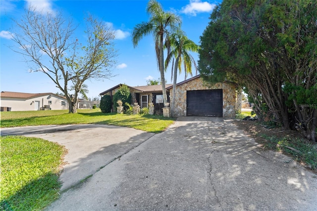 ranch-style house with a front yard and a garage