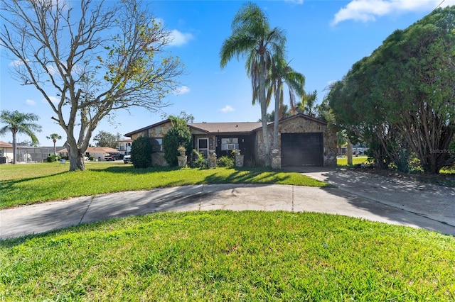 single story home with a front yard and a garage