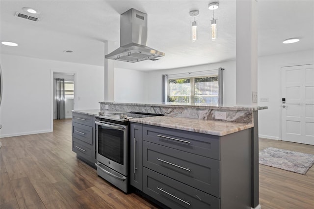 kitchen featuring light stone countertops, gray cabinetry, island range hood, and stainless steel electric stove