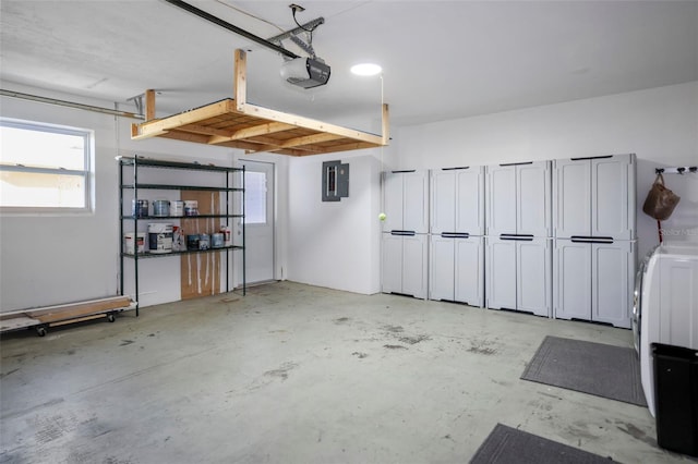 garage with electric panel and a garage door opener