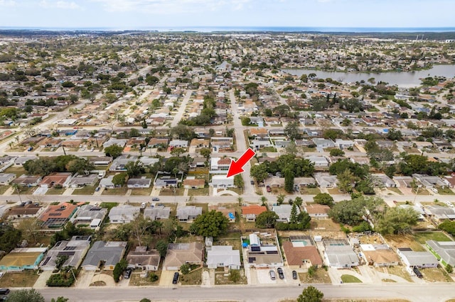 aerial view with a residential view and a water view