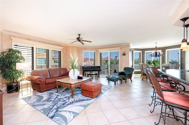 tiled living room featuring ceiling fan with notable chandelier and ornamental molding