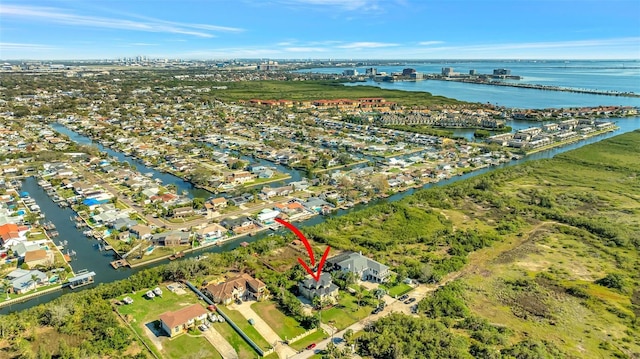 birds eye view of property featuring a water view