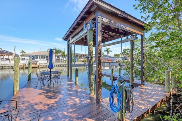 dock area featuring a water view and boat lift