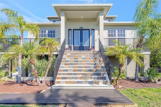 property entrance featuring french doors