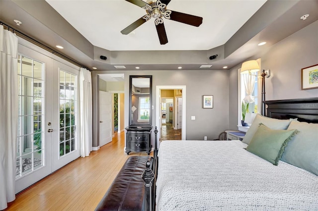 bedroom featuring light wood-type flooring, access to exterior, recessed lighting, and french doors