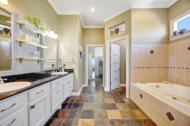 full bath with ornamental molding, a sink, a tub with jets, and double vanity