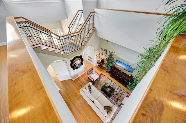 stairway featuring wood finished floors