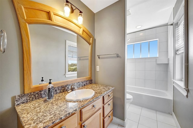 bathroom with shower / bathtub combination, toilet, vanity, tile patterned flooring, and baseboards