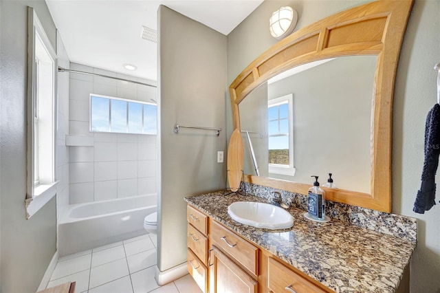 bathroom featuring shower / bathtub combination, toilet, visible vents, vanity, and tile patterned floors