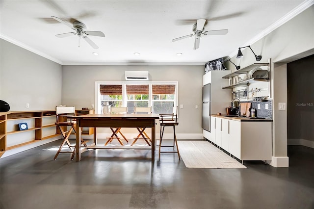 dining space with crown molding, an AC wall unit, concrete floors, and baseboards