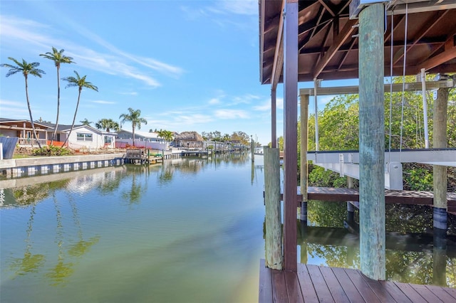 dock area featuring a residential view and a water view