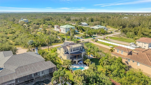 bird's eye view featuring a wooded view