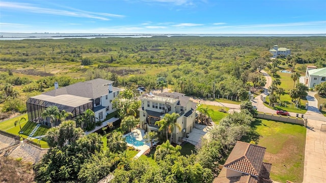 drone / aerial view featuring a view of trees