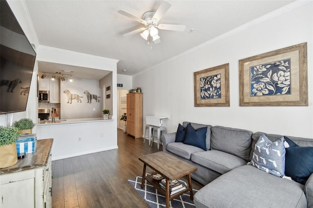 living room with a ceiling fan, baseboards, ornamental molding, and dark wood-type flooring