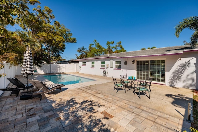 view of swimming pool with a patio, a fenced backyard, and a fenced in pool