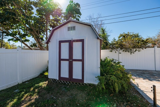 view of shed featuring a fenced backyard