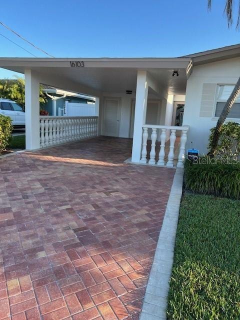 exterior space with a carport