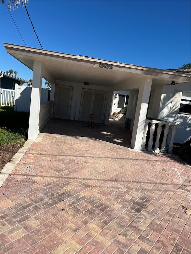 exterior space featuring a carport