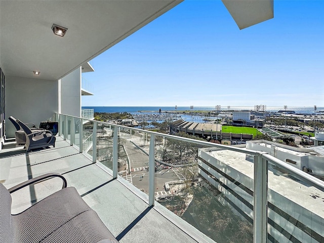 balcony featuring a water view