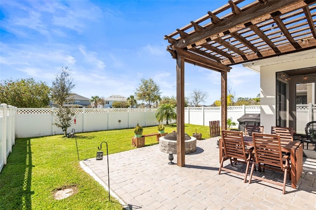 view of patio featuring outdoor dining space, a fenced backyard, a pergola, and an outdoor fire pit