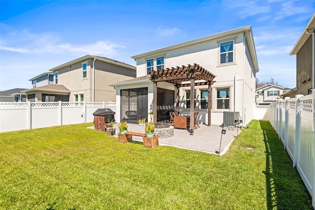 back of house with a pergola, a fenced backyard, a yard, a sunroom, and a patio area