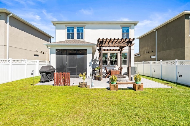 back of house with a lawn, a pergola, a fenced backyard, a sunroom, and a patio area