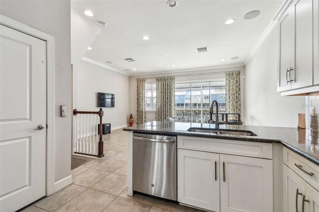 kitchen featuring stainless steel dishwasher, sink, crown molding, and white cabinets