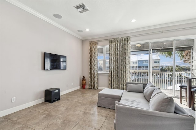 living room featuring plenty of natural light and crown molding