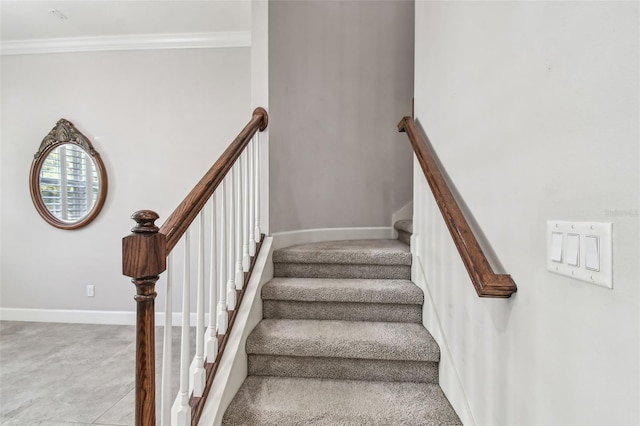 stairway featuring crown molding